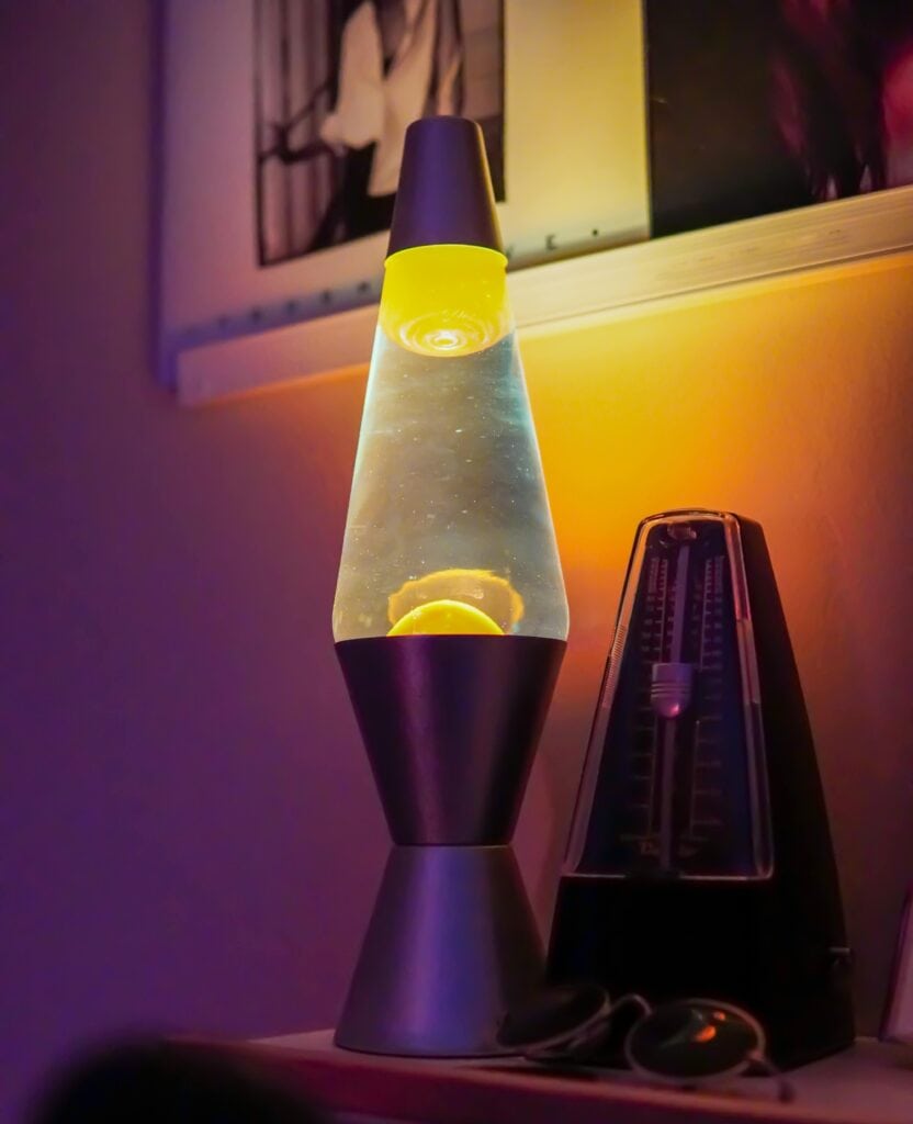 Lava lamp and a metronome on a table