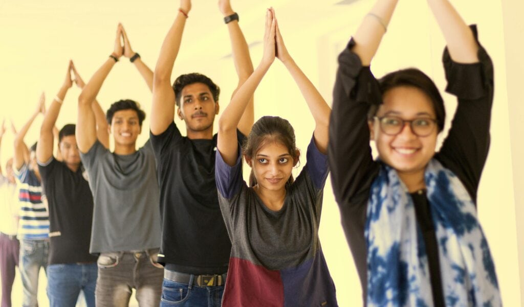 high school students in a line participating in sensory yoga